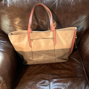 The purse is an OrYany, tan, grey and orange.